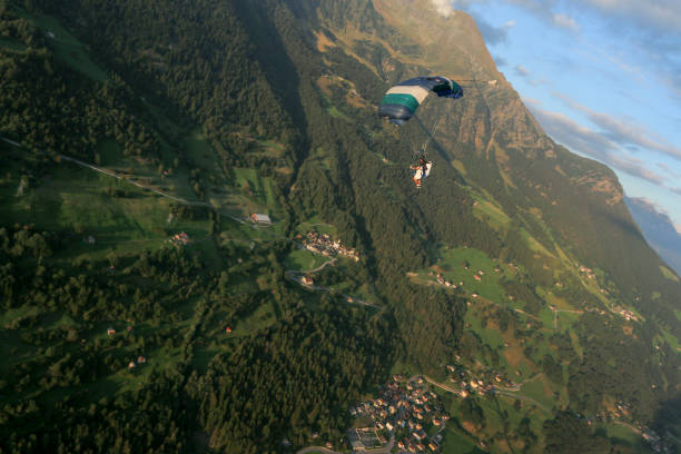 istock Paraglider soars over Swiss Alps 1254134016