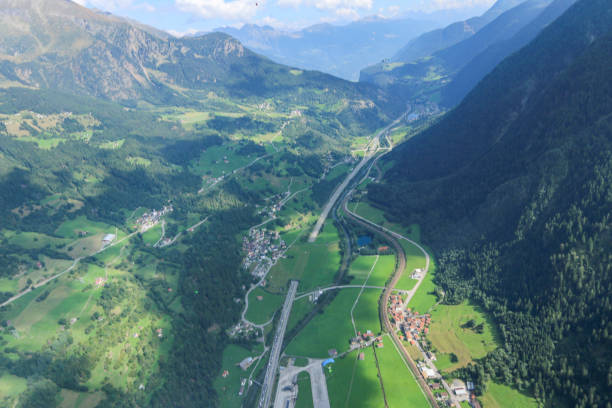 istock Wing suit flier soars over Swiss Alps 1254134811