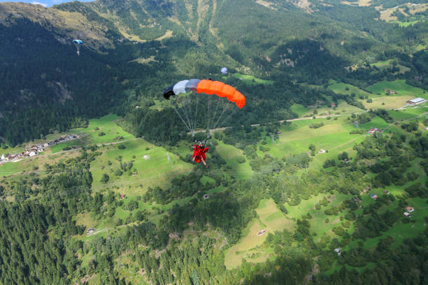 istock Paragliders soar over Swiss Alps 1254134836