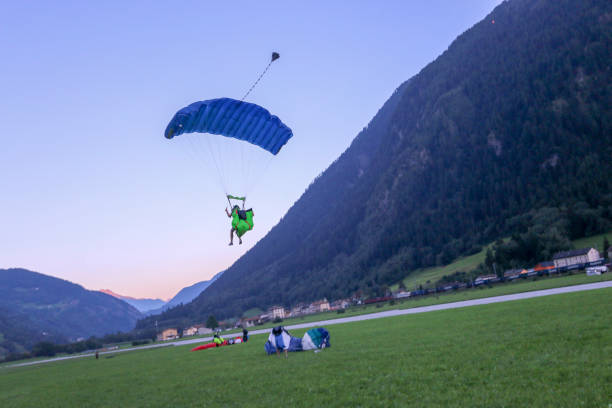 istock Paragliders soar over Swiss Alps 1254134976