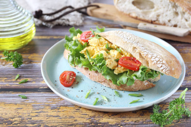 istock French bread sandwich with scrambled eggs, lettuce and cherry tomatoes 1254136635