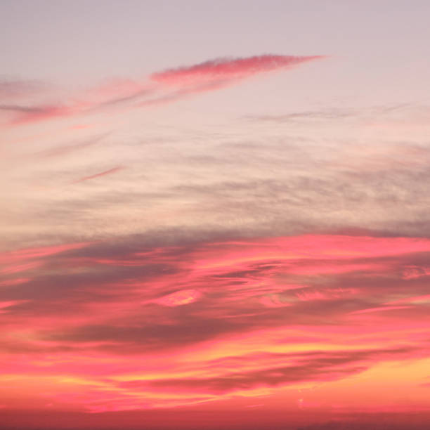 istock Red sunset and orange clouds on a dark blue sky, background 1254143440