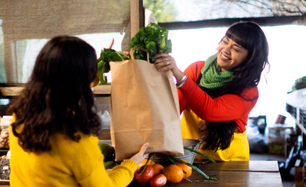 istock young Latina women in fruitmaking 1254143768