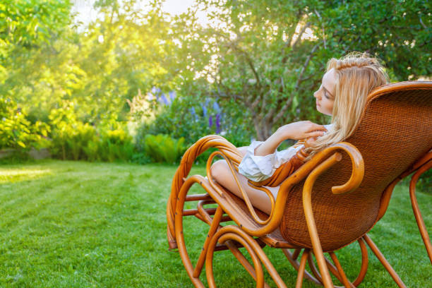 istock Young beautiful blonde woman relaxing at backyard 1254144497
