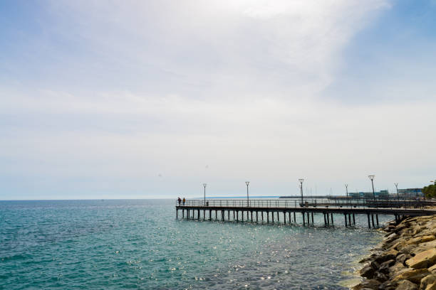 Limassol, Cyprus - March 3, 2018: Pier in Mediterranean sea in the Limassol Municipal Garden and Embankment