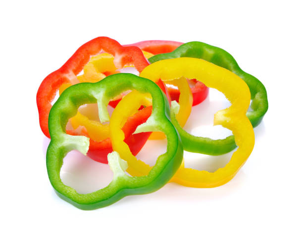 istock Sliced red yellow green pepper isolated on white 1254150301