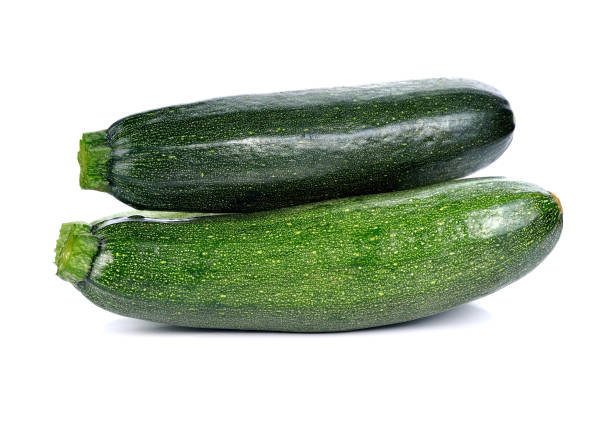 istock Fresh zucchini isolated on white 1254150316
