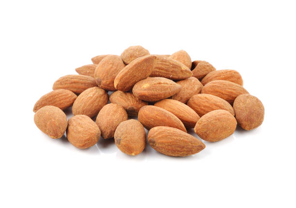 istock Pile of almond nuts isolated on white background 1254150414