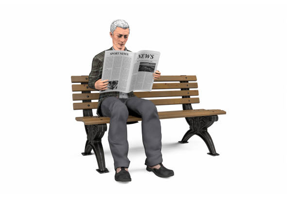 istock Old man reading a newspaper on a park bench 1254168612