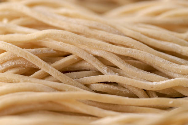 istock Raw Asian Ramen Noodle Texture, Egg Noodle or Mie Ayam 1254169553