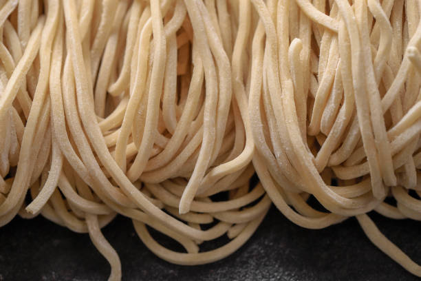 istock Raw Asian Ramen Noodle Texture, Egg Noodle or Mie Ayam 1254169761