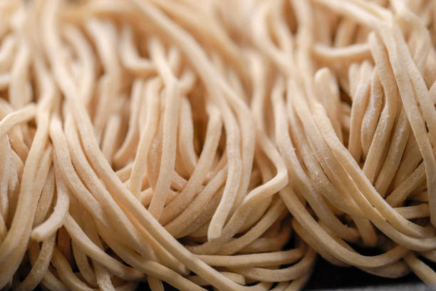 istock Raw Asian Ramen Noodle Texture, Egg Noodle or Mie Ayam 1254170468