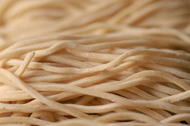 istock Raw Asian Ramen Noodle Texture, Egg Noodle or Mie Ayam 1254170506