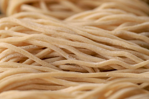 istock Raw Asian Ramen Noodle Texture, Egg Noodle or Mie Ayam 1254170521