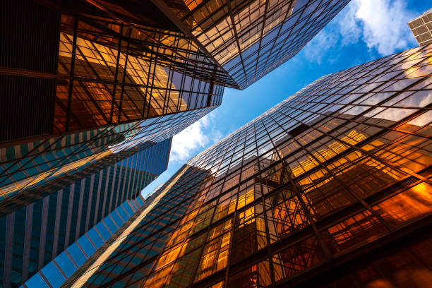 istock abstract perspective golden lighting on buildings and blue sky with cloud 1254170755