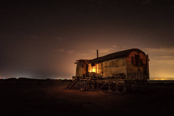 istock Old fishing hut in the night 1254172705