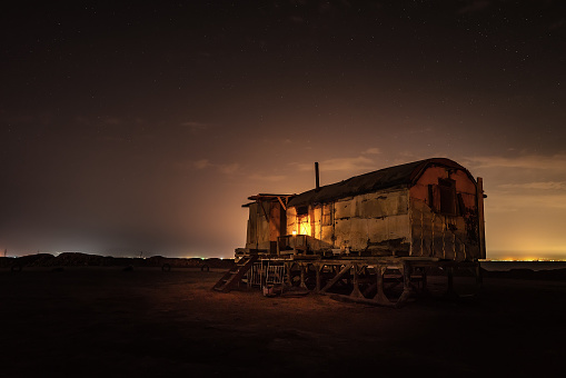 Old fishing hut in the night