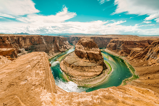 The Colorado river shaped as a horseshoe at the Grand Canyon deserts.