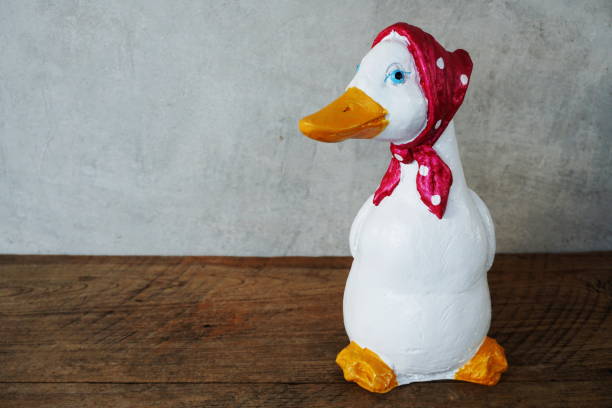 Decorative ceramic duck interior decor with space copy on wooden background