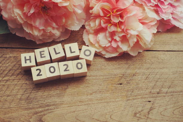 istock Hello 2020 alphabet letter with space copy on wooden background 1254174521