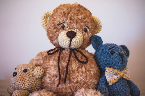 istock Cute wool teddy bears are lying on the table 1254181427