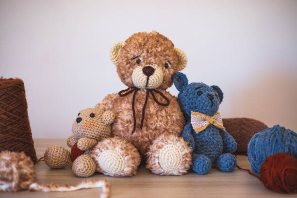 istock Cute wool teddy bears are lying on the table 1254181465