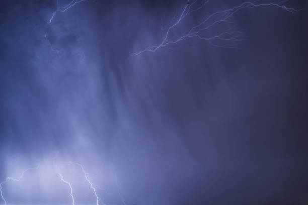 istock Flashes of lightning in the night sky. 1254183855
