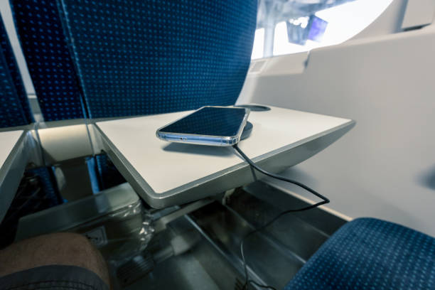 istock charging the phone with a wireless charger while traveling by train 1254185067