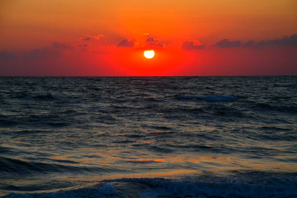 istock Beautiful colourful sunrise on the sea 1254189199