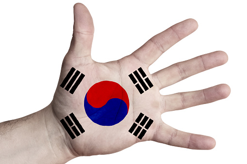 Open palm with the image of the flag of South Korea. Multipurpose concept. Image on a white background. Isolate
