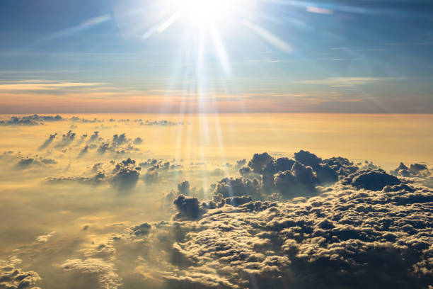 istock Beautiful sunrise sky above clouds with dramatic light. Cabin view from airplane 1254194683