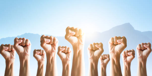 istock Competition and teamwork concepts, People raise fists. 1254196055