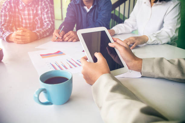 istock Business team two colleagues discussing financial graph data on office table. 1254197716