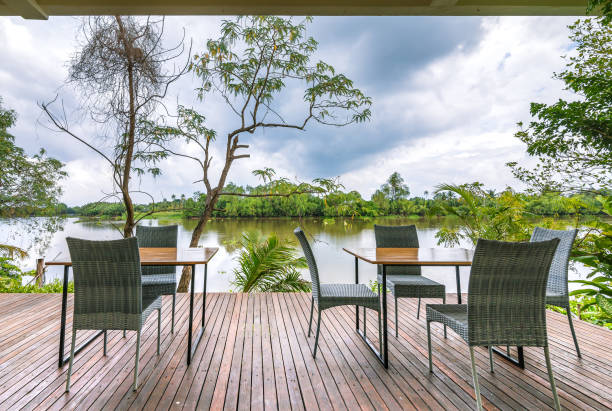 istock Empty tables and chairs on the riverside with outdoor. 1254199525