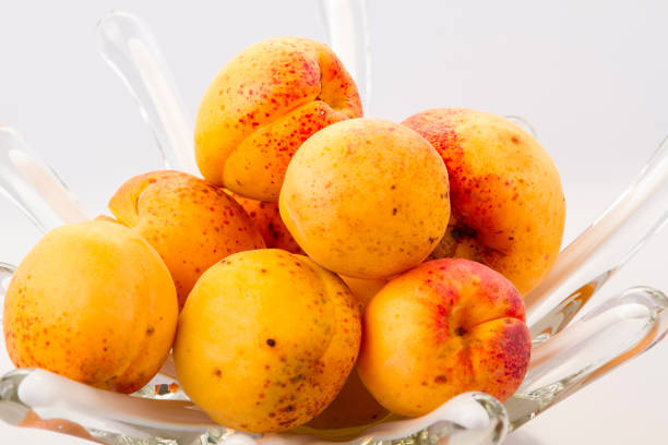 Apricots in a glass vase