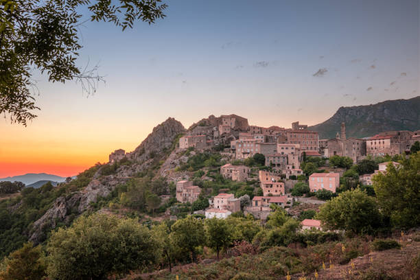 istock Dawn breaking over Speloncato in Corsica 1254201843