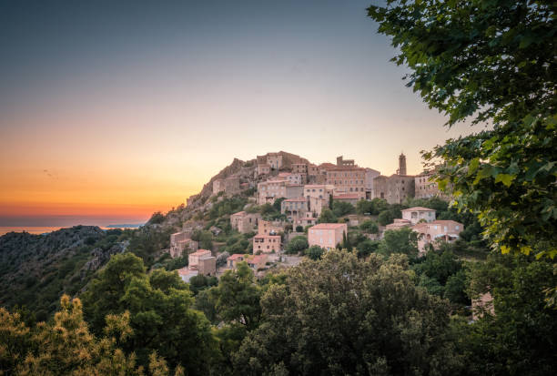 istock Dawn breaking over Speloncato in Corsica 1254201846