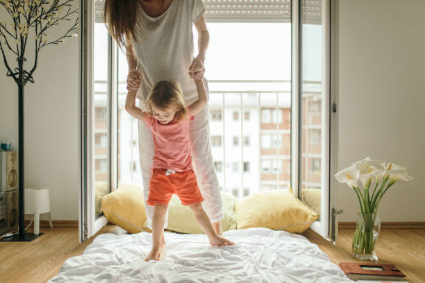 istock Mother and daughter are playing at home 1254202242