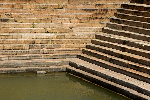 Horizontal and diagonal pattern of stone steps at pond in Melukote, Mandya District, Karnataka, India, Asia