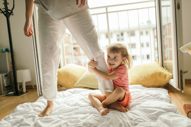 istock Mother and daughter are playing at home 1254203070