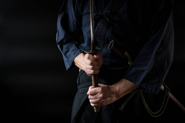 istock The man holding japanese sword 1254205634