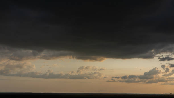 istock Evening sky and rain clouds, countryside landscape. 1254205666