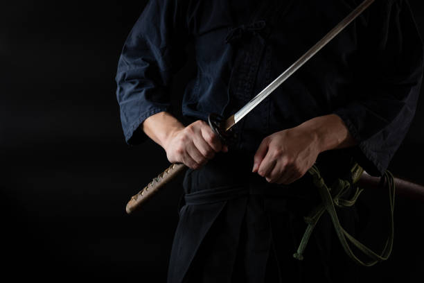 istock The man holding japanese sword 1254205837