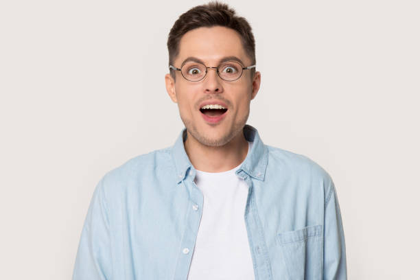 istock Surprised millennial man with eyes wide open looking at camera 1254205859