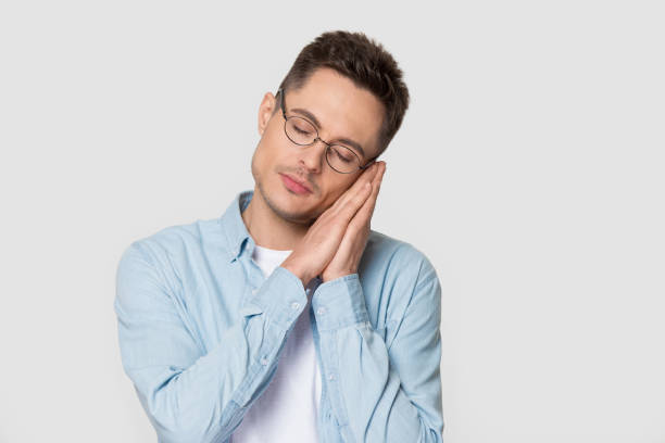 istock Millennial handsome stylish man showing falling asleep with eyes closed 1254205871