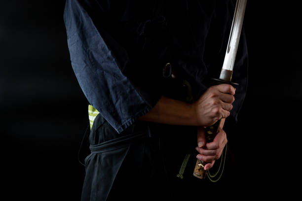 istock The man holding japanese sword 1254205907