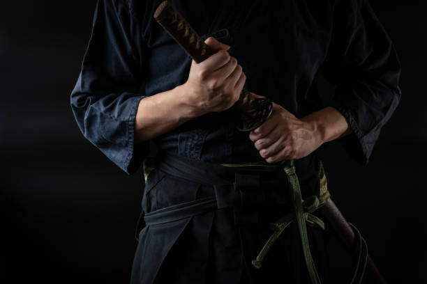 istock The man holding japanese sword 1254206842