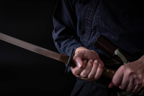 istock The man holding japanese sword 1254207053
