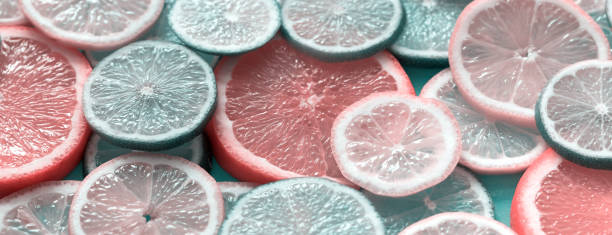 istock Citrus fruits slices texture background 1254207334