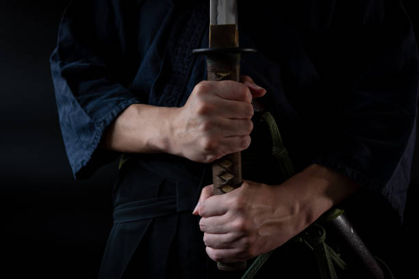 The man holding japanese sword stock photo
